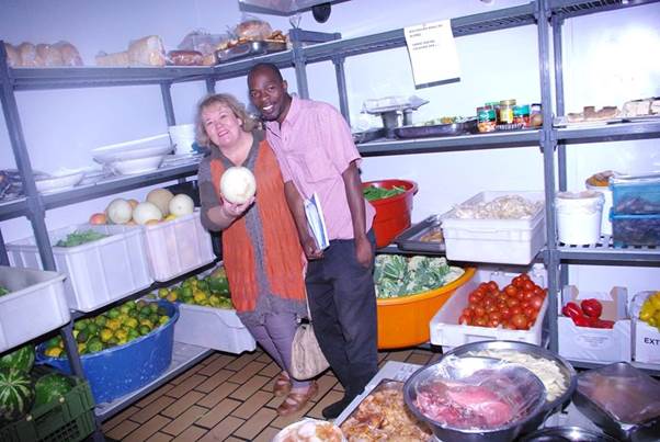 Image may contain: 2 people, people smiling, indoor and food